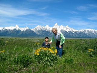 She didn't want me to get her in the picture. She was trying to pose Ben by the flowers.